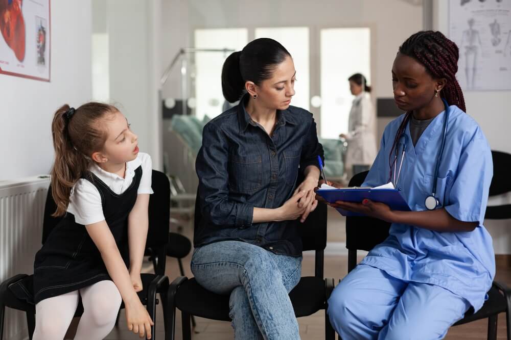 Nurse meeting with patient at healthcare facility